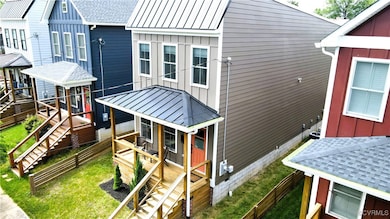 Hardiplank siding and metal roof stoop makes for e