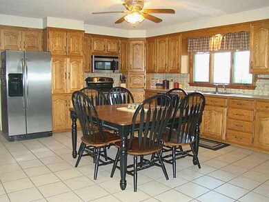 Kitchen. Oak cabinets, tiled floor,...