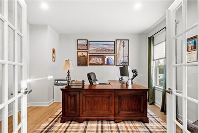Main floor office with French doors and large wind