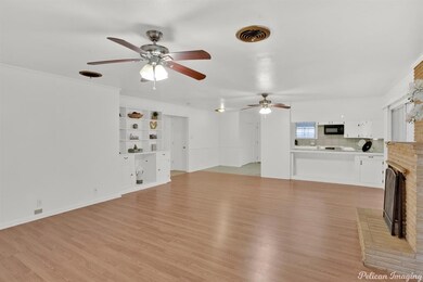 Living Room with built ins and connected to the ki