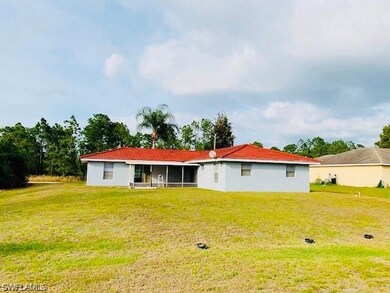 410 Broadmoor St, Lehigh Acres, FL 33974 - photo 2