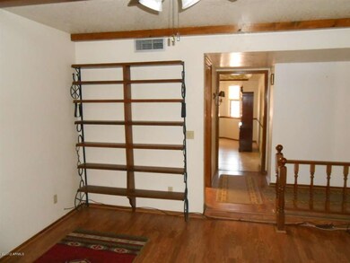 family room facing hall & dining