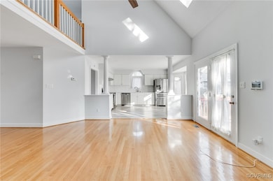 Open floor plan living space leading into kitchen