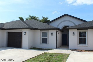 Single story home with an attached garage, stucco