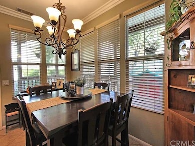 Spacious and  bright dining area can easily fit a 