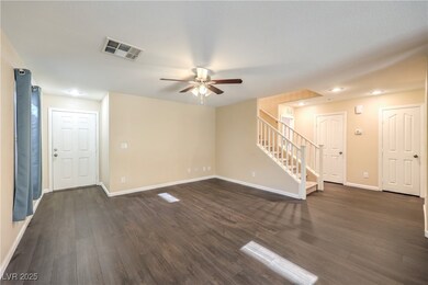 Unfurnished living room featuring a ceiling fan, s