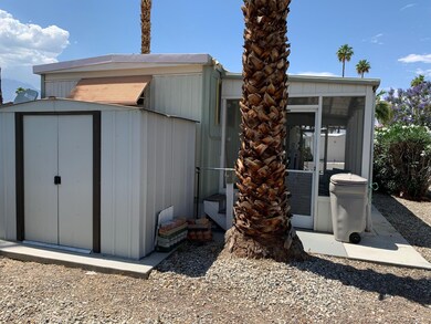 152 Rear with shed and laundry.