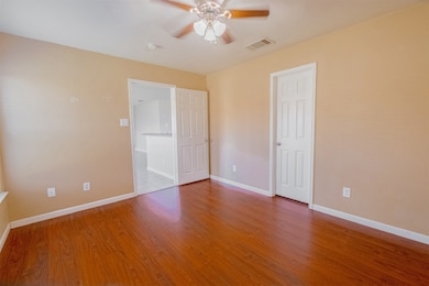 Unfurnished bedroom with light wood-style floors and a ceiling fan