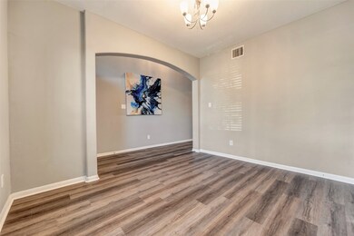 This room features elegant wood-style flooring, ne