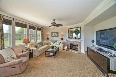Family Room Features a Cozy Stone Fireplace, Ralph