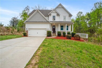 Craftsman-style home featuring covered porch, a fr