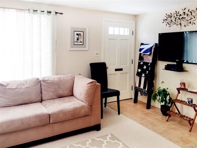 Spacious living room with tiled entry