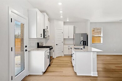 This open, airy kitchen offers plenty of space and