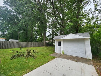 Garage with garage and a lawn
