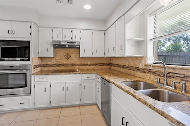 Bright, modern kitchen with freshly painted cabine
