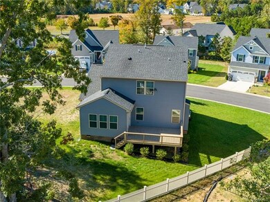 Aerial view of the back of the house and large dec