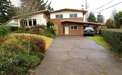 HOUSE FRONT with CARPORT