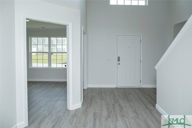 View of foyer from living room. To the left is the