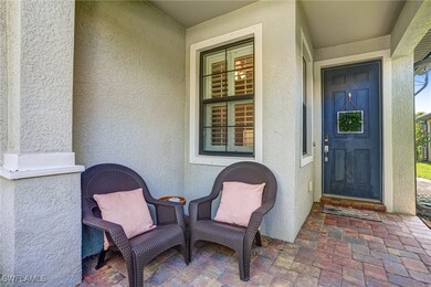 Entrance to property with stucco siding