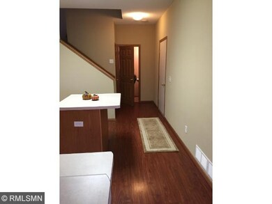 Wood laminated flooring through the kitchen and th