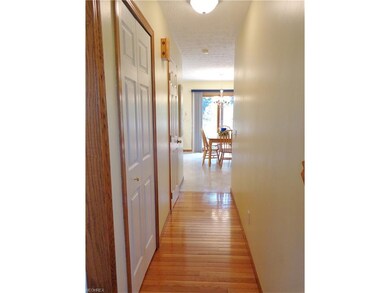 front hallway leads back to the kitchen.  Notice t