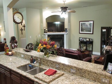 Rinse the dishes in the sink and watch TV at the same time!