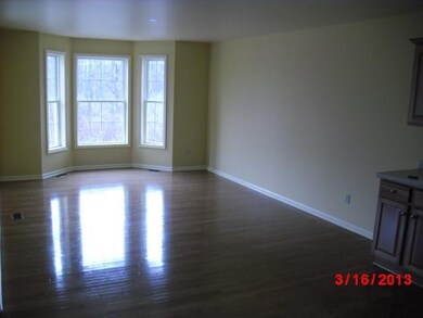 Dining Room Gleaming hardwood floor with walk in b
