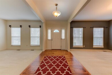 Entry Foyer facing Front Door with Formal Dining r