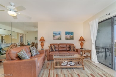 Living room featuring sink and ceiling fan