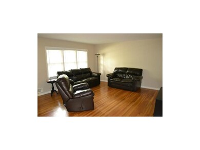 Living room has hard wood flooring!