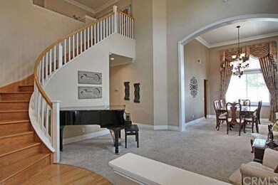 Grand Entrance Boasts wood spiral staircase, vault