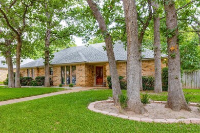 Ranch-style home with a front yard