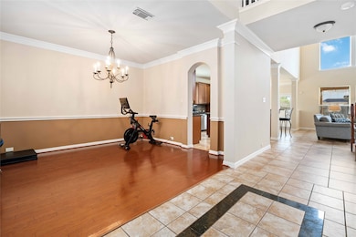 Formal dining room w/ wood floors.
