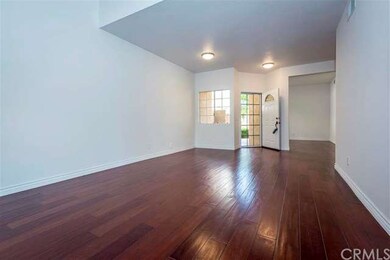 Living room looking towards front door and den