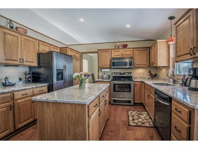 Kitchen features generous cabinetry, center island