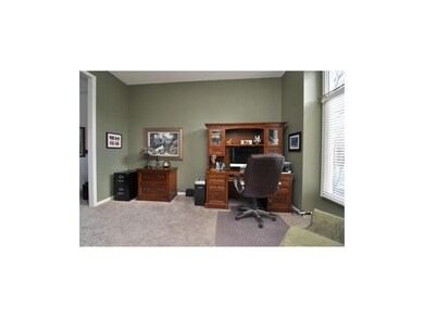 Convenient main floor office/den is sun-filled