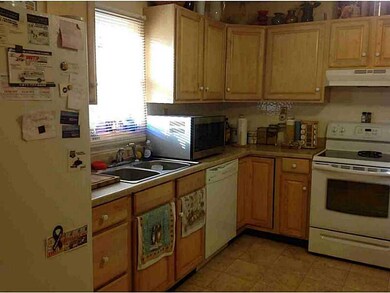Kitchen. New cabinets and flooring brighten the ki