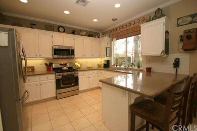 Spacious kitchen with quartz counters and stainles