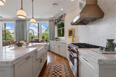 Chef's kitchen with top of the line appliances and upgraded marble countertops