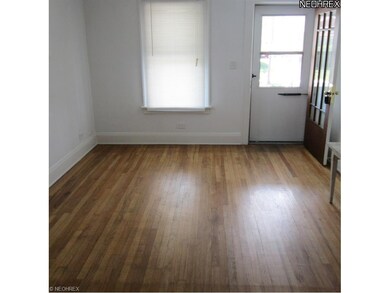 LIVING ROOM WITH HARDWOOD FLOORING