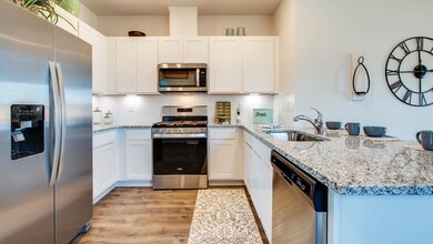 Pictures are of previously completed home of same floorplan. Features may vary.  HOME WILL HAVE WHITE QUARTZ COUNTERTOPS
