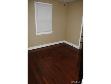 Bedroom 2 also has hardwood floors and built in sh