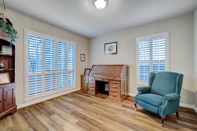 Transform your work routine into a
haven of productivity and comfort in
this thoughtfully designed home
office. Featuring windows with plantation shutters that allow in
natural light.