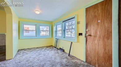 Unfurnished room with crown molding, a wealth of n
