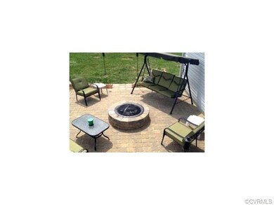 Brick patio with firepit ready for you and your fa