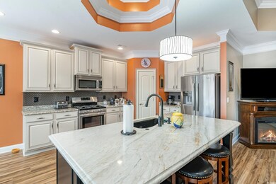 Kitchen with stainless steel appliances, hanging l