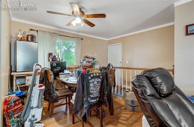 Office featuring ornamental molding, wood-type flo