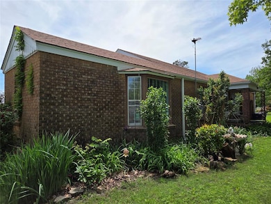 View of home's exterior featuring brick siding