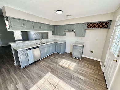 Kitchen with a sink, visible vents, stainless stee