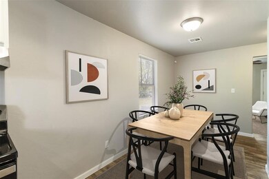 Dining area staged with table and chairs